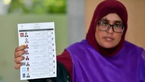 An electoral worker shows a ballot paper during counting the for Maldives’ presidential election in Male on September 9, 2023. | Photo Credit: MOHAMED AFRAH