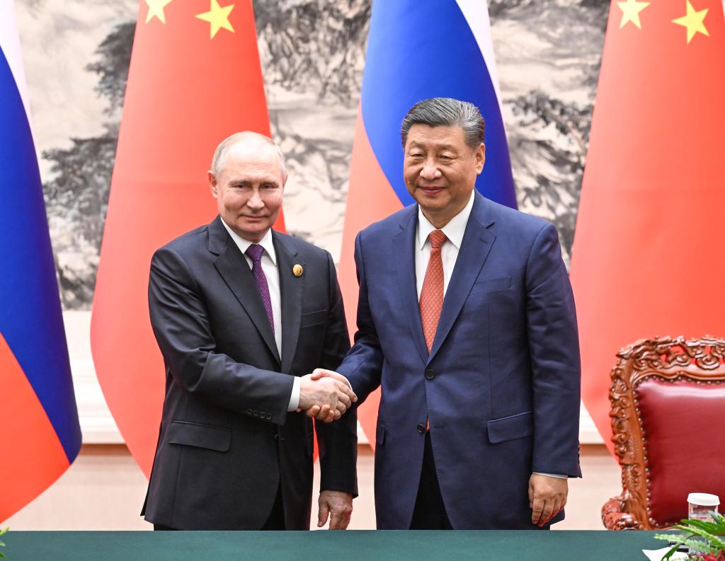 Putin in trade push on final day of China trip