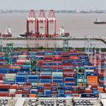 A drone view shows electric vehicles (EV) for export and containers sitting at a port in Shanghai, China April 13, 2025. Photo: China Daily via REUTERS